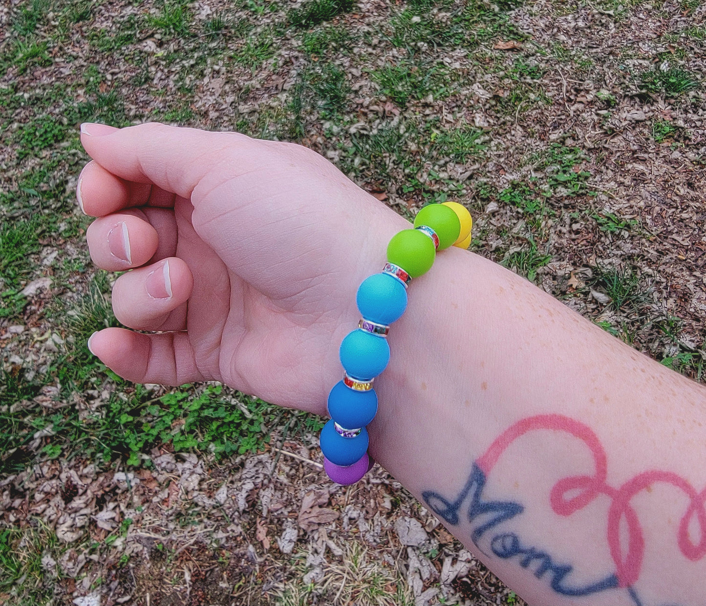 Silicone rainbow and rhinestone puppy dog paw bracelet